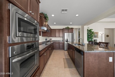 Make this magnificent Treviso model with enchanting water views on Tuscany Falls At Pebble Creek in Arizona - for sale on GolfHomes.com, golf home, golf lot