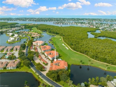 Enjoy spectacular golf course from this end unit, 2-bedroom on Windstar on Naples Bay in Florida - for sale on GolfHomes.com, golf home, golf lot