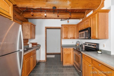 The ''Cabin'' is your opportunity to own a spacious, yet cozy on Centennial Acres Golf Club in Michigan - for sale on GolfHomes.com, golf home, golf lot