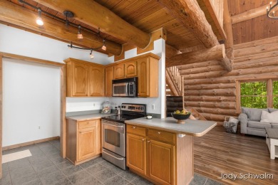 The ''Cabin'' is your opportunity to own a spacious, yet cozy on Centennial Acres Golf Club in Michigan - for sale on GolfHomes.com, golf home, golf lot