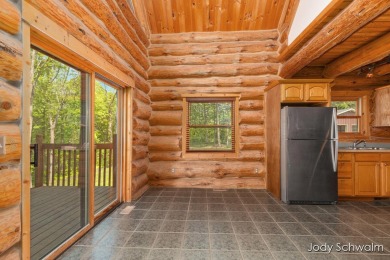 The ''Cabin'' is your opportunity to own a spacious, yet cozy on Centennial Acres Golf Club in Michigan - for sale on GolfHomes.com, golf home, golf lot
