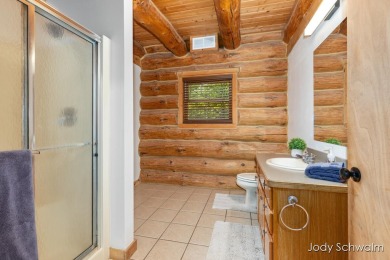 The ''Cabin'' is your opportunity to own a spacious, yet cozy on Centennial Acres Golf Club in Michigan - for sale on GolfHomes.com, golf home, golf lot