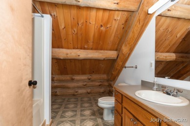 The ''Cabin'' is your opportunity to own a spacious, yet cozy on Centennial Acres Golf Club in Michigan - for sale on GolfHomes.com, golf home, golf lot