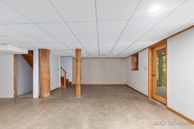 The ''Cabin'' is your opportunity to own a spacious, yet cozy on Centennial Acres Golf Club in Michigan - for sale on GolfHomes.com, golf home, golf lot