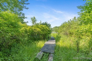 The ''Cabin'' is your opportunity to own a spacious, yet cozy on Centennial Acres Golf Club in Michigan - for sale on GolfHomes.com, golf home, golf lot