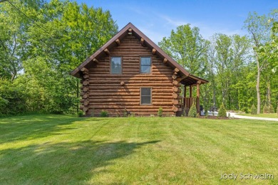 The ''Cabin'' is your opportunity to own a spacious, yet cozy on Centennial Acres Golf Club in Michigan - for sale on GolfHomes.com, golf home, golf lot