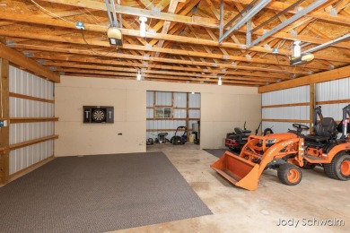 The ''Cabin'' is your opportunity to own a spacious, yet cozy on Centennial Acres Golf Club in Michigan - for sale on GolfHomes.com, golf home, golf lot