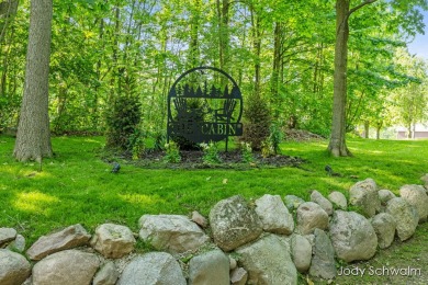The ''Cabin'' is your opportunity to own a spacious, yet cozy on Centennial Acres Golf Club in Michigan - for sale on GolfHomes.com, golf home, golf lot