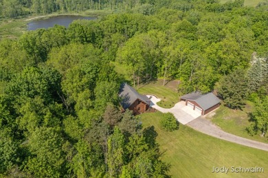 The ''Cabin'' is your opportunity to own a spacious, yet cozy on Centennial Acres Golf Club in Michigan - for sale on GolfHomes.com, golf home, golf lot