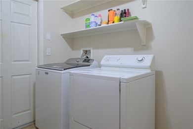 Discover true coastal comfort in this charming 2-bedroom, 2-bath on Rockport Country Club in Texas - for sale on GolfHomes.com, golf home, golf lot