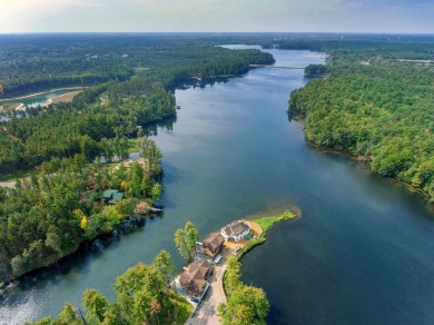 Over 60' of frontage on beautiful NEPCO Lake. This wooded lot on The Ridges Golf Club in Wisconsin - for sale on GolfHomes.com, golf home, golf lot