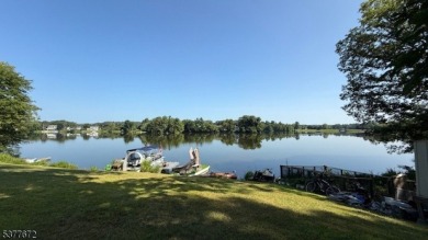 Relax in this updated end-unit, lakefront townhome offering a on High Point Golf Club in New Jersey - for sale on GolfHomes.com, golf home, golf lot