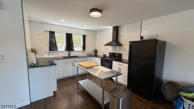 Relax in this updated end-unit, lakefront townhome offering a on High Point Golf Club in New Jersey - for sale on GolfHomes.com, golf home, golf lot