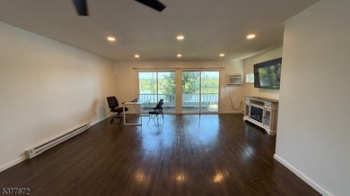 Relax in this updated end-unit, lakefront townhome offering a on High Point Golf Club in New Jersey - for sale on GolfHomes.com, golf home, golf lot