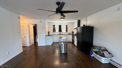 Relax in this updated end-unit, lakefront townhome offering a on High Point Golf Club in New Jersey - for sale on GolfHomes.com, golf home, golf lot