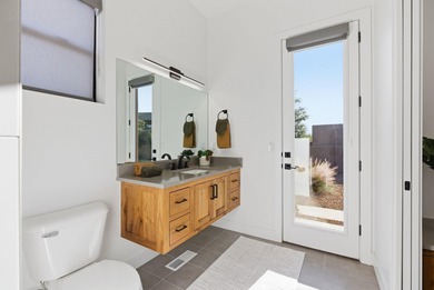 As you are welcomed into your tucked-in private entry courtyard on The Ledges Golf Club in Utah - for sale on GolfHomes.com, golf home, golf lot