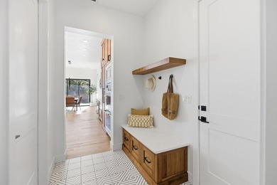 As you are welcomed into your tucked-in private entry courtyard on The Ledges Golf Club in Utah - for sale on GolfHomes.com, golf home, golf lot