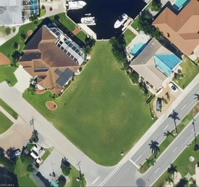 This exceptional waterfront corner lot in Punta Gorda Isles on Saint Andrews South Golf Club in Florida - for sale on GolfHomes.com, golf home, golf lot