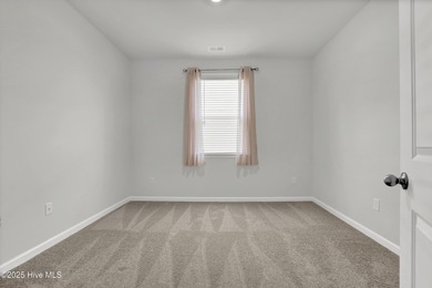 Welcome to this charming cottage with manicured landscaping on Lennon Hills Golf Course in North Carolina - for sale on GolfHomes.com, golf home, golf lot