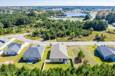 Welcome to this charming cottage with manicured landscaping on Lennon Hills Golf Course in North Carolina - for sale on GolfHomes.com, golf home, golf lot