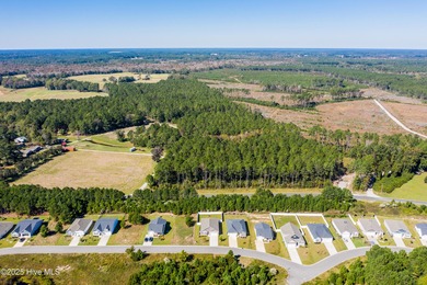 Welcome to this charming cottage with manicured landscaping on Lennon Hills Golf Course in North Carolina - for sale on GolfHomes.com, golf home, golf lot