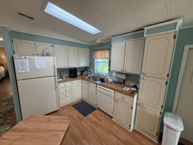 This well-cared for 2-bedroom, 2-bathroom home is being sold on Del Tura Golf and Country Club in Florida - for sale on GolfHomes.com, golf home, golf lot
