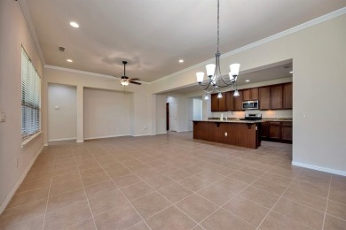 This beautifully maintained corner lot half duplex home is on Wildhorse Golf Club of Robson Ranch in Texas - for sale on GolfHomes.com, golf home, golf lot