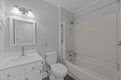 Escape to your own one-bedroom condo in a peaceful resort-style on Harbour Point Golf Club in North Carolina - for sale on GolfHomes.com, golf home, golf lot