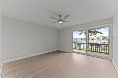Escape to your own one-bedroom condo in a peaceful resort-style on Harbour Point Golf Club in North Carolina - for sale on GolfHomes.com, golf home, golf lot
