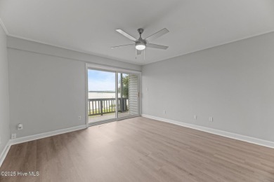 Escape to your own one-bedroom condo in a peaceful resort-style on Harbour Point Golf Club in North Carolina - for sale on GolfHomes.com, golf home, golf lot