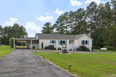 Welcome to your dream home, nestled on hole 9 of the prestigious on Tanglewood Shores Golf and Country Club in Virginia - for sale on GolfHomes.com, golf home, golf lot