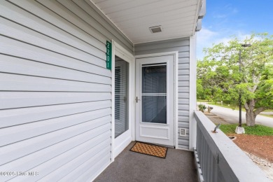 Escape to your own one-bedroom condo in a peaceful resort-style on Harbour Point Golf Club in North Carolina - for sale on GolfHomes.com, golf home, golf lot