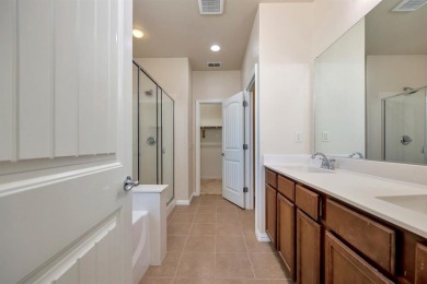 This beautifully maintained corner lot half duplex home is on Wildhorse Golf Club of Robson Ranch in Texas - for sale on GolfHomes.com, golf home, golf lot