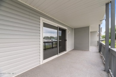 Escape to your own one-bedroom condo in a peaceful resort-style on Harbour Point Golf Club in North Carolina - for sale on GolfHomes.com, golf home, golf lot