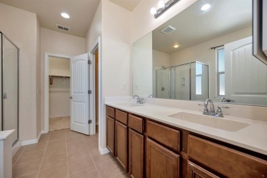 This beautifully maintained corner lot half duplex home is on Wildhorse Golf Club of Robson Ranch in Texas - for sale on GolfHomes.com, golf home, golf lot