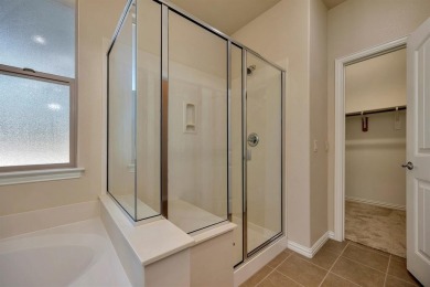 This beautifully maintained corner lot half duplex home is on Wildhorse Golf Club of Robson Ranch in Texas - for sale on GolfHomes.com, golf home, golf lot