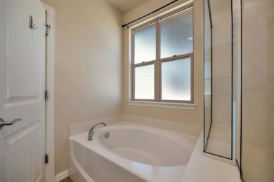 This beautifully maintained corner lot half duplex home is on Wildhorse Golf Club of Robson Ranch in Texas - for sale on GolfHomes.com, golf home, golf lot