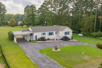 Welcome to your dream home, nestled on hole 9 of the prestigious on Tanglewood Shores Golf and Country Club in Virginia - for sale on GolfHomes.com, golf home, golf lot