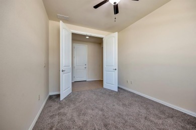 This beautifully maintained corner lot half duplex home is on Wildhorse Golf Club of Robson Ranch in Texas - for sale on GolfHomes.com, golf home, golf lot
