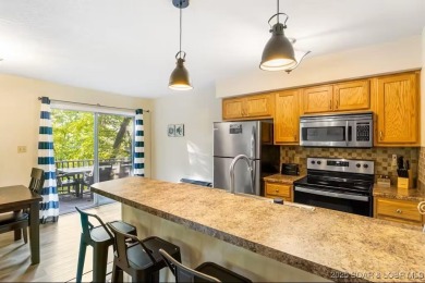 Welcome home to this beautiful 3 bedroom, 3 bathroom retreat on on The Oaks Golf Course in Missouri - for sale on GolfHomes.com, golf home, golf lot