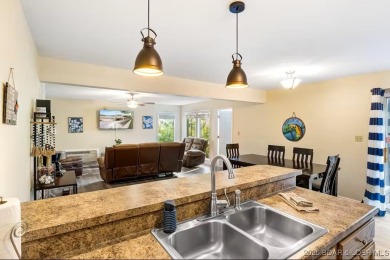 Welcome home to this beautiful 3 bedroom, 3 bathroom retreat on on The Oaks Golf Course in Missouri - for sale on GolfHomes.com, golf home, golf lot