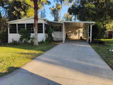 Over 1200 sq. ft. of comfortable living with a 1 car garage on Ocala Palms Golf and Country Club in Florida - for sale on GolfHomes.com, golf home, golf lot