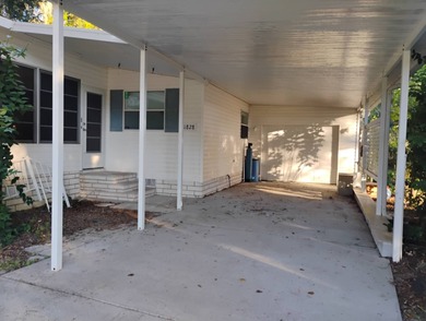 Over 1200 sq. ft. of comfortable living with a 1 car garage on Ocala Palms Golf and Country Club in Florida - for sale on GolfHomes.com, golf home, golf lot