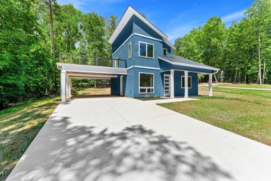 DO IT TODAY AND NOT SOMEDAY! This contemporary newly constructed on The Trail At Chickasaw Pointe in South Carolina - for sale on GolfHomes.com, golf home, golf lot
