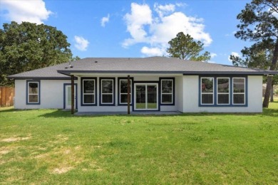 Step inside this 4 bedroom, 2 bath, with an office/flex room on Pine Forest Golf Club in Texas - for sale on GolfHomes.com, golf home, golf lot