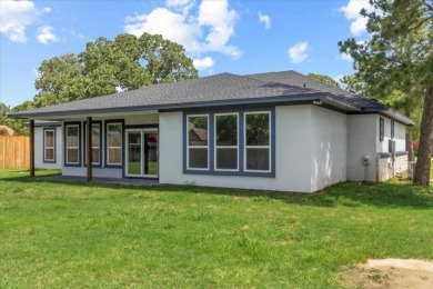 Step inside this 4 bedroom, 2 bath, with an office/flex room on Pine Forest Golf Club in Texas - for sale on GolfHomes.com, golf home, golf lot