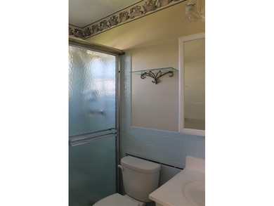 This single-family home located in Unit 2 of Mainlands by the on Mainlands Golf Club in Florida - for sale on GolfHomes.com, golf home, golf lot