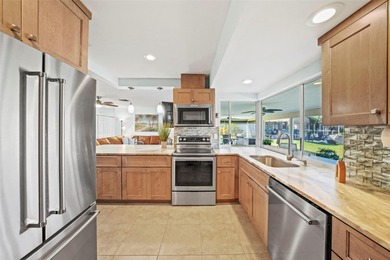 Experience the perfect blend of coastal charm and modern comfort on Gulf Harbors Golf Course in Florida - for sale on GolfHomes.com, golf home, golf lot