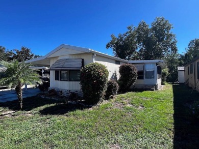 Discover easy Florida living in this 2-bedroom, 2-bath home on Lake Henry Golf Club in Florida - for sale on GolfHomes.com, golf home, golf lot