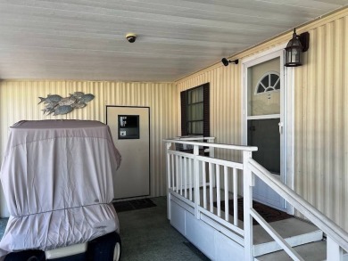 Discover easy Florida living in this 2-bedroom, 2-bath home on Lake Henry Golf Club in Florida - for sale on GolfHomes.com, golf home, golf lot